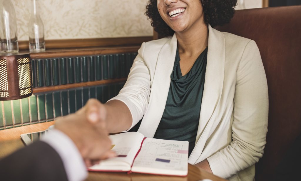 woman-shaking-hands-with-business-partner-1